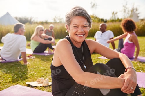 Preview: Active Adults Enjoying Yoga Session in Outdoor Setting