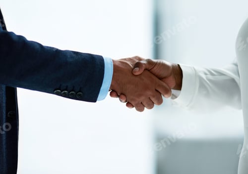 Preview: Closeup shot of two unidentifiable businesspeople shaking hands in an office