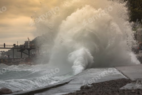 Preview: Huge stormy waves crashing near the city embankmen. Big sea wave splash. Giant waves