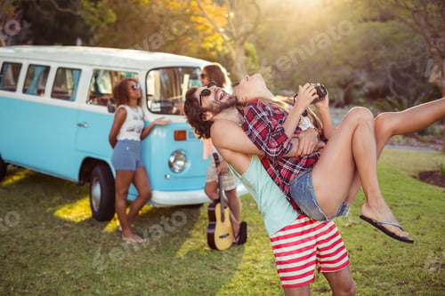 Preview: Man carrying a woman in park
