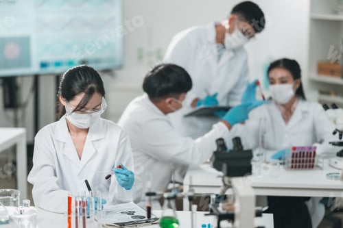 Preview: Scientist examining biological samples under a microscope in medical research laboratory