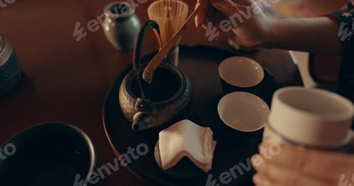 Preview: Hands of woman in traditional Japanese matcha, drink and relax with mindfulness, respect and servic