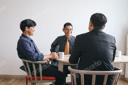 Preview: Group of Businessman Having Conversation During Break
