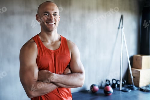 Preview: Training to become fighting fit. Portrait of a man at the gym.