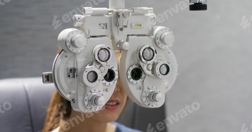 Preview: Woman checks her eye in clinic