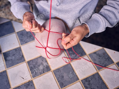 Preview: Elderly person sewing natural sausage