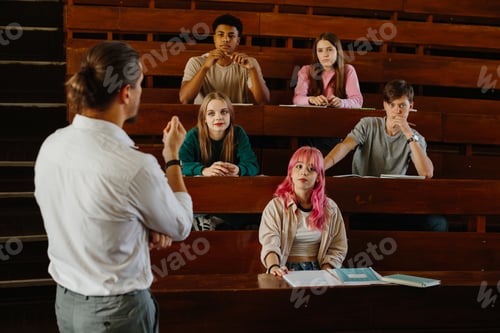 Preview: Group of Students Interacting and Learning in a Lecture Hall Setting