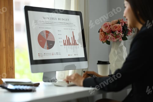 Preview: Beautiful asian woman entrepreneur working on investment and marketing projects at modern office.