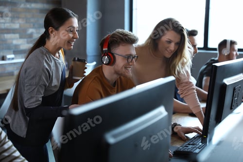 Preview: Group of people playing video games in internet cafe