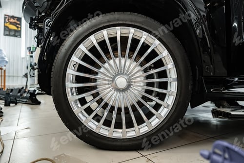 Preview: Close up view of a wheel of luxury car.