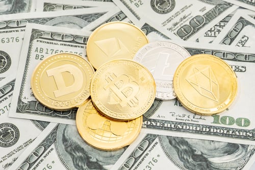 Preview: Group of cryptocurrency coin on dollar banknotes background