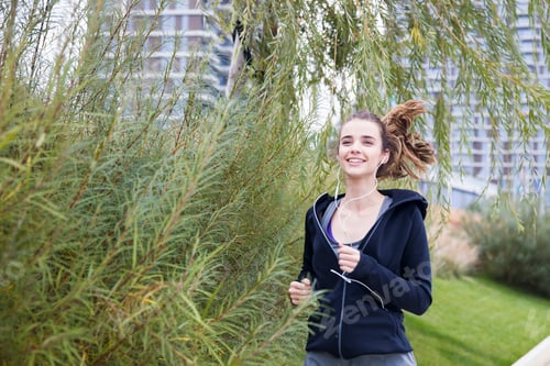 Preview: Fitness woman training and jogging in autumn park