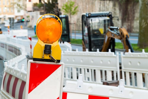 Preview: Orange construction Street barrier light on barricade. Road construction on the streets of European