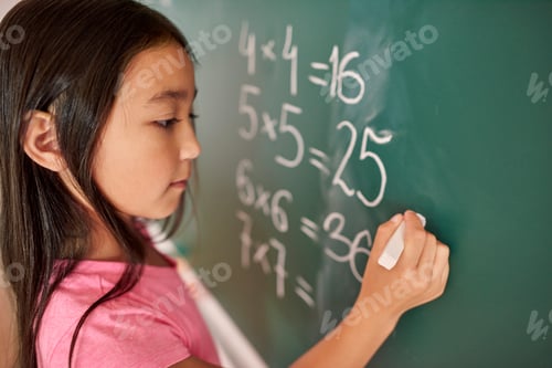 Preview: Focus girl trying to solve mathematical equation