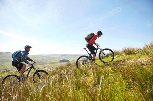 Preview: Cyclists cycling up hillside