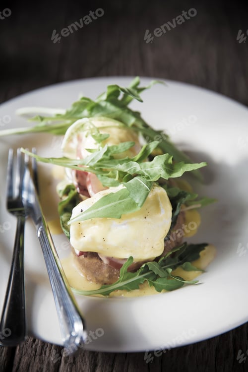 Preview: Egg Benedict On Wood Background