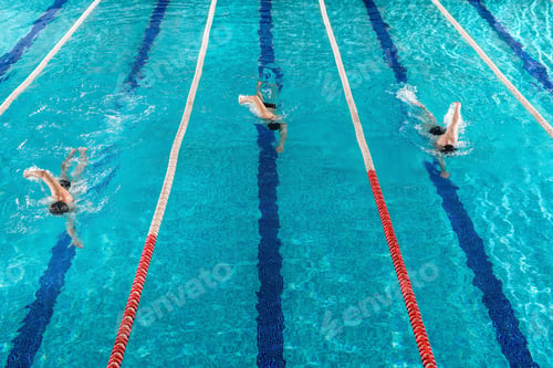 Preview: Three male swimmers racing against each other