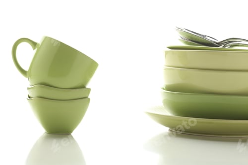 Preview: Beautiful multi-coloured bright ceramic bowl and tarenes on the table. Clean crockery concept