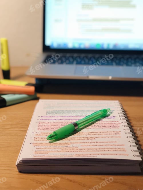 Preview: Photo of a pen lying on a notebook with text, studying