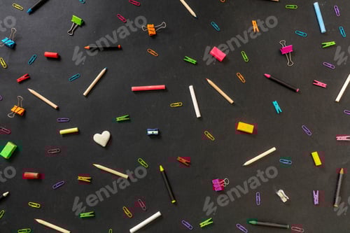 Preview: Back to school background. School office supply and stationery flat lay on black, top view