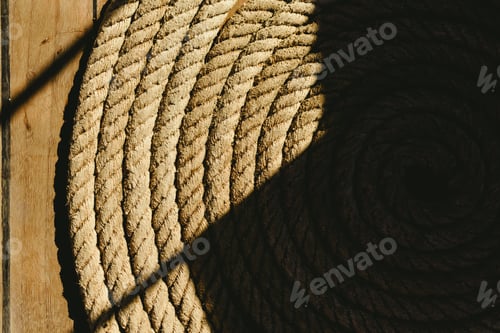 Preview: Large rolled-up boat dock with dark background.