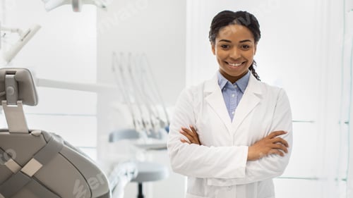 Preview: Stomatologic Services. Smiling Black Female Dentist Doctor Posing In Modern Clinic Interior