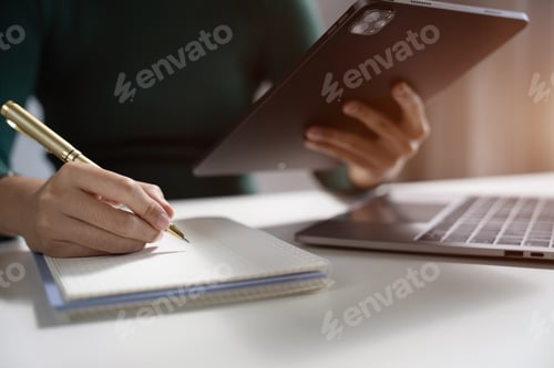 Preview: Female businessman thinking ideas strategy working concept at the desk in the office.