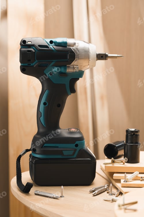 Preview: Cordless Power Drill on Wood Table with Screws
