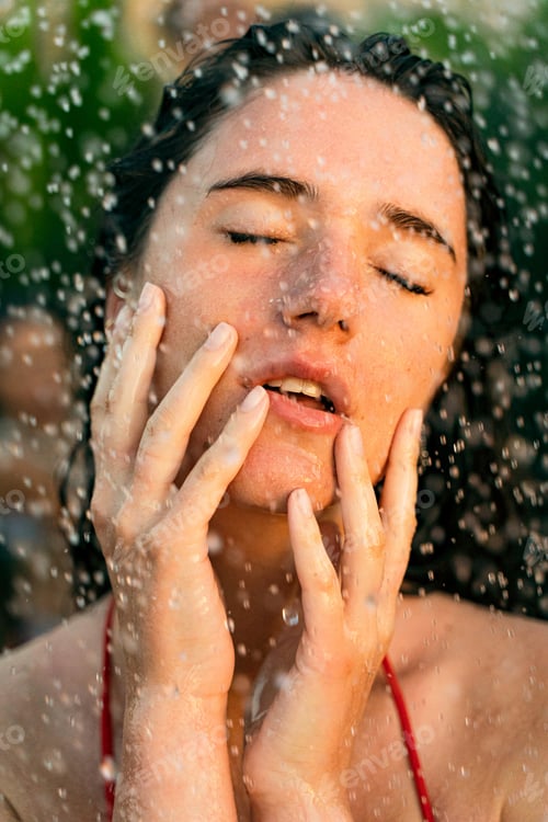 Preview: Woman portrait with tropical shower water drops. Spa treatment