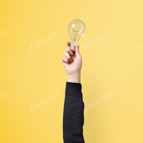 Preview: Light bulb creative business idea symbol held by a hand
