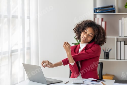 Preview: A young American woman is a start-up businesswoman, she sits in the office and is relaxing.