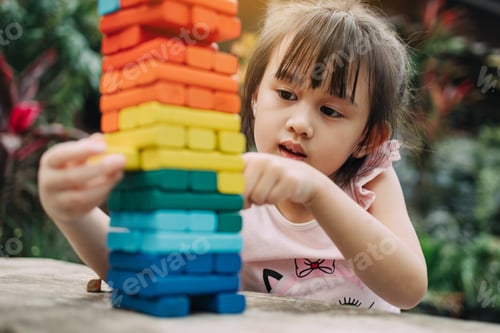 Preview: Kid playing wooden blocks as a leisure activity for practice plan and strategy thinking