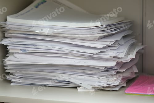Preview: Documents and papers in a pile, documents in an office