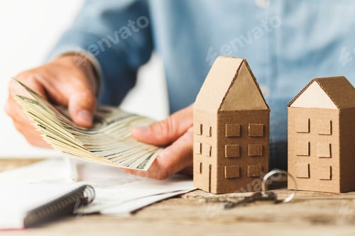 Preview: Money, Keys, and Miniature Cardboard Houses