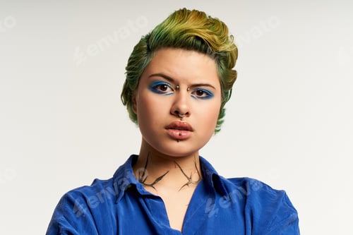 Preview: Vibrant woman with stylish hair and bold makeup posing confidently against a clean background