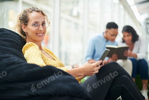 Preview: Shot of a young businesswoman using a digital tablet in a modern office
