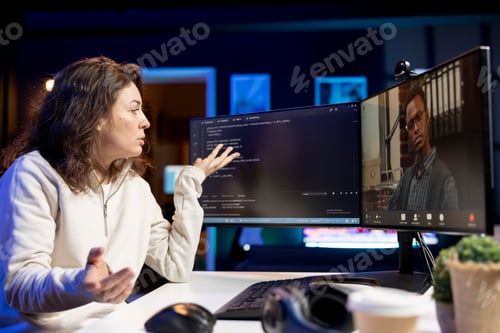 Preview: Software technician teacher doing online tutoring, talking with student