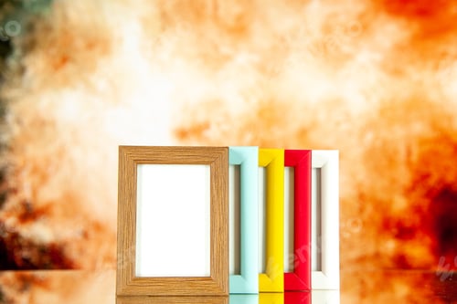 Preview: front view different picture frames with colored corners on light brown background picture portrait