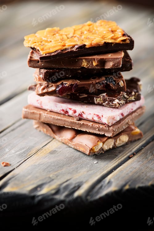 Preview: Mix of sweet swiss choccolate on the wooden table