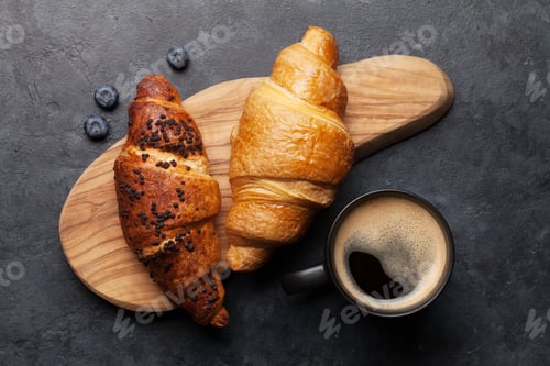 Preview: Croissants and Coffee on a Cutting Board