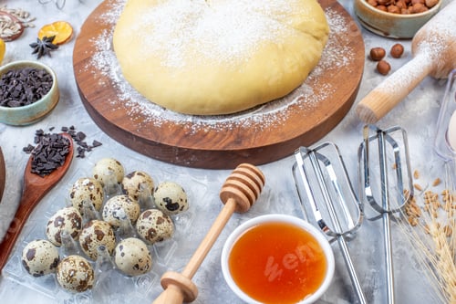 Preview: Front view of raw pastry flour on round board grater fresh fruits eggs honey on gray background