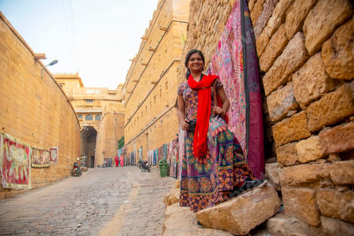 Preview: Woman tourist at golden fort Jaisalmer, India.