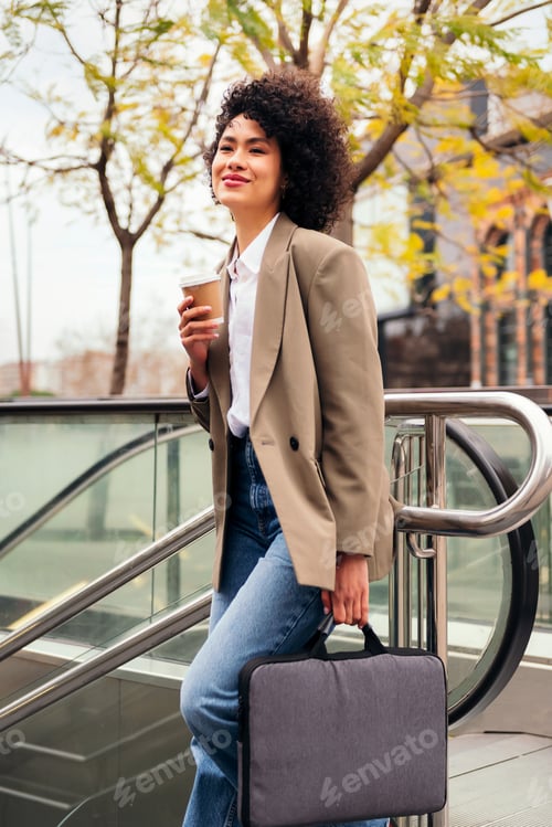 Preview: woman entering the subway station with a briefcase
