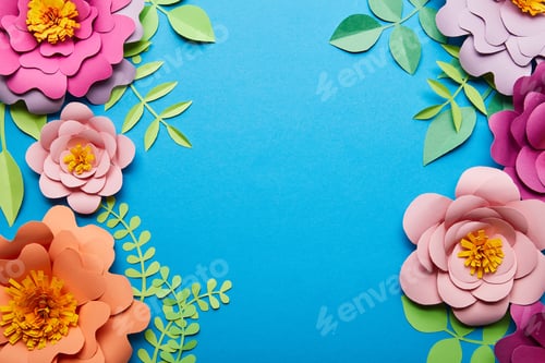 Preview: top view of multicolored paper cut flowers with green leaves on blue background with copy space