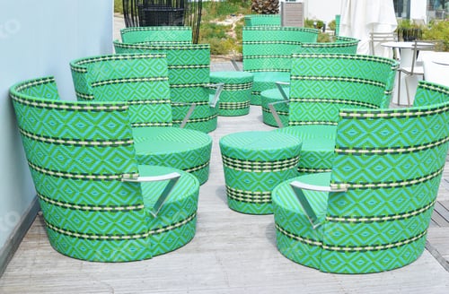 Preview: green wicker chairs and table in a restaurant