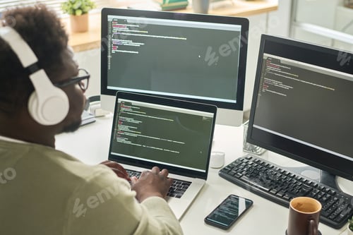 Preview: Man working on computer in IT office