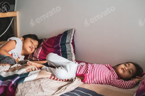 Preview: cute children sleeping on the bed in the morning