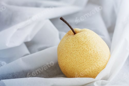 Preview: pear on white tablecloth