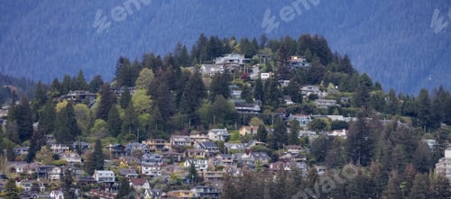 Preview: Residential Homes in a modern city with mountain landscape in background.