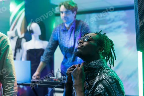 Preview: Man in sunglasses relaxing in club
